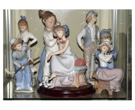 Lladro porcelain figure of a girl on a telephone, together with six Nao porcelain figures, 25cm high and smaller   Condition: