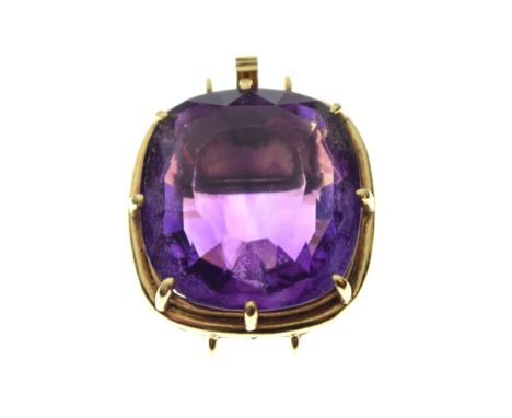 Faceted amethyst-coloured stone of approximately 17mm x 18.5mm, within yellow metal tonneau frame and clasp stamped 18k/750, 