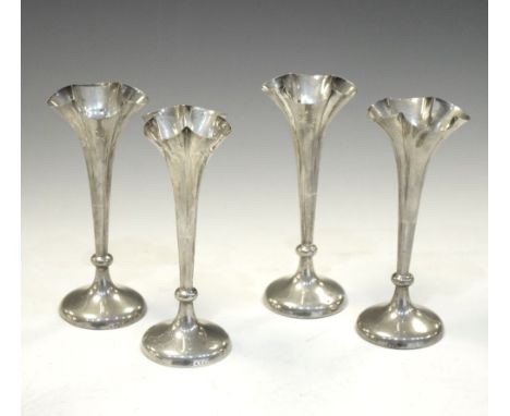 Set of four Victorian silver bud vases with splayed rims, 14cm high   Condition: Several vases have a slight lean, some minor