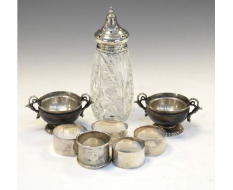 Pair of Victorian silver gilt and turned wood salts with scroll handles and standing on a pedestal base, Birmingham 1871, tog