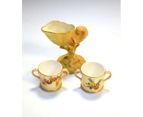 Royal Worcester small vase modelled as an upright nautilus shell, together with two miniature loving cups with floral painted