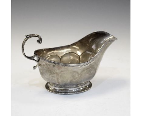 George V silver sauce boat with scroll handle and standing on pedestal base, Birmingham 1935, 110g approx   Condition: **Due 