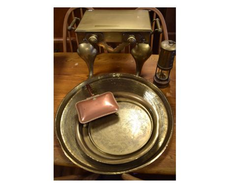 Brass footman, together with three Eastern brass trays, copper warming dish and a miner's safety lamp   Condition: Right leg 