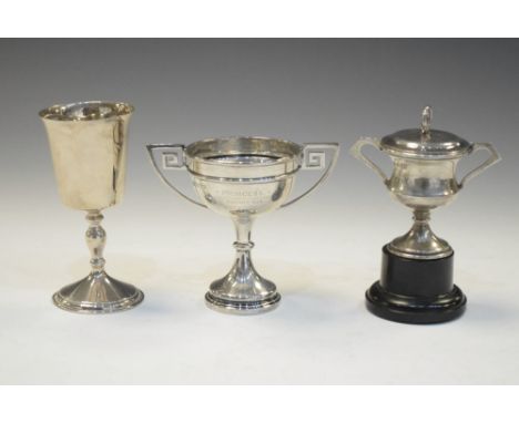 Two silver twin handled trophy cups, Sheffield 1922 and Birmingham 1937, together with an Elizabeth II silver goblet, Birming