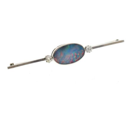 White metal, diamond and opal brooch, the central doublet approximately 20mm wide flanked by two old-cut stones totalling app