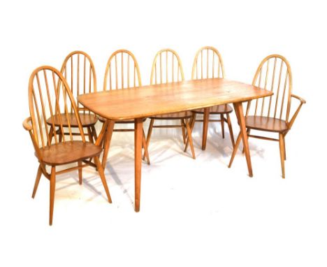 Ercol Golden Dawn elm dining room suite of table, four chairs, two armchairs   Condition: Table top with numerous marks, sign