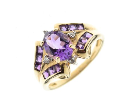 9ct gold dress ring set faceted oval amethyst-coloured central stone flanked by two small diamonds and further square-cut ame