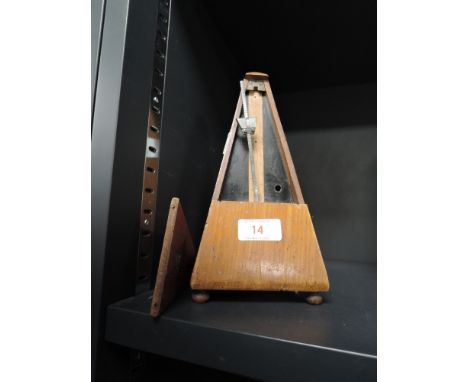 A vintage wooden cased Maelzel musical metronome