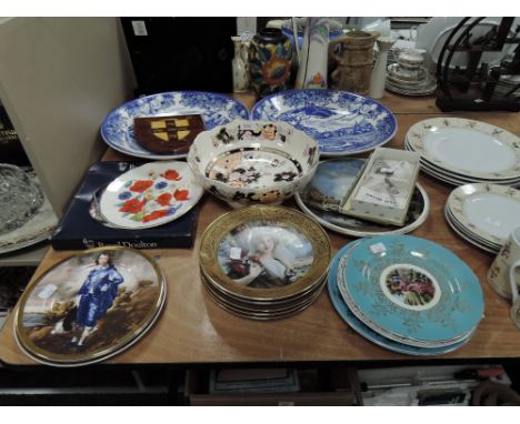 A selection of ceramic plates including blue and white wears