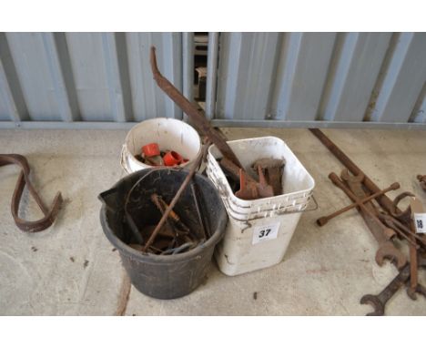 Three buckets of various items to include some blacksmith's tools, chains etc.