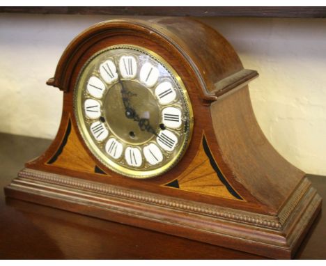 A reproduction Art Deco style inlaid wooden clock.