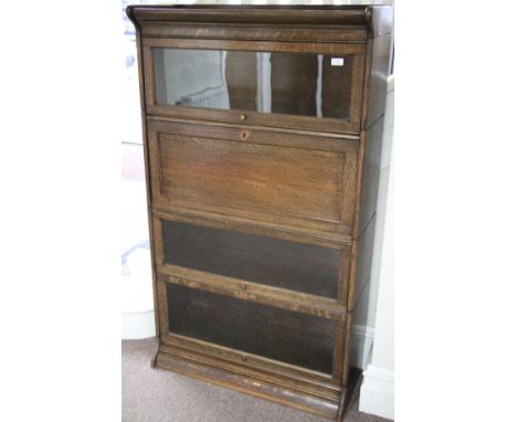 A Globe Werniker style book case comprising of three glass front sections plus bureau section.