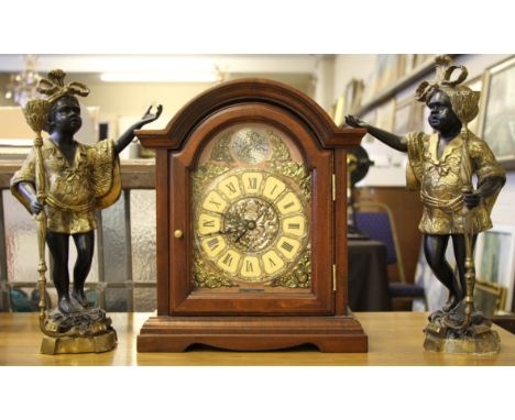 A pair of modern cast metal gilt blackamoor style figures Ht 38cm together with a modern quartz mantle clock.