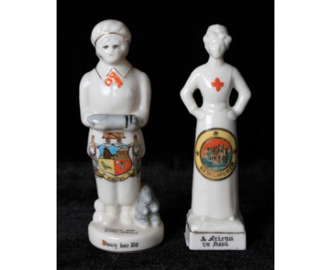 Two WW1 Crested Ware figures; one of a female shell maker by Carlton China with motto 'Shells and more Shells, Doing her bit'