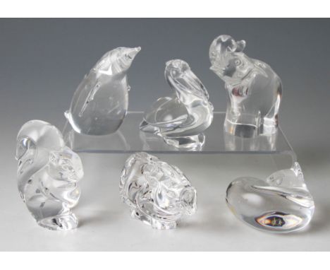 A group of six Steuben clear glass animals to include; penguin, squirrel, fox, elephant, pelican and rhino.