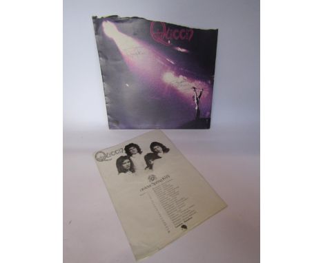 QUEEN: A 'Queen' LP sleeve bearing autographs of Freddie Mercury and Roger Taylor, the sleeve has been torn where it was orig