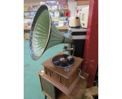 A 1930's oak gramophone with painted metal speaker horn, together with a small quantity of 78's 
