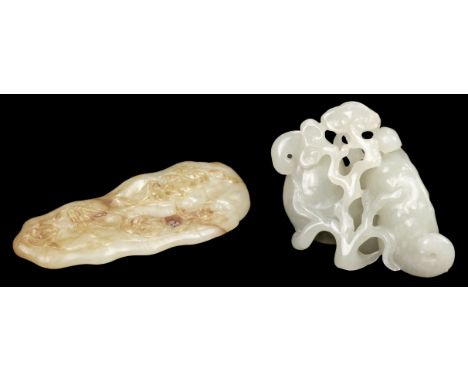 * Chinese Jade pebble, carved as a Lingxi tree, approximately 7 cm long, together with a shaped jade pebble with brown riveri