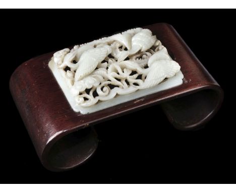 * Chinese pen or brush rest, scroll wood inset with a carved jade panel showing three exotic birds amongst foliage, 13 cm lon