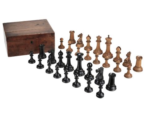 * An Edwardian Jaques Staunton weighted chess set, circa 1910, the weighted boxwood and ebony chess set, complete, (one ebony
