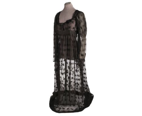 * A Regency black mourning gown, circa 1810, hand-stitched black silk muslin dress with woven vine leaf pattern, high-waisted