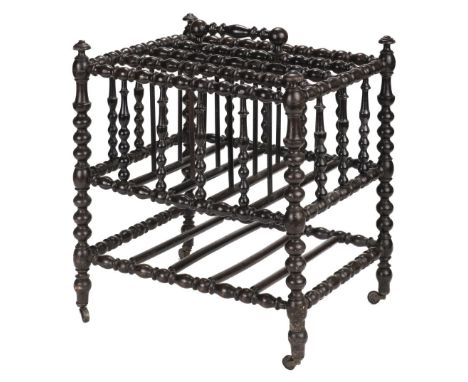 * A Victorian bobbin turned canterbury, with carrying handle on brass casters, 49 cm high x 41 cm wideQTY: (1)NOTE:Provenance
