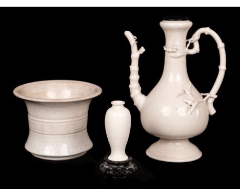 * Chinese crackle glazed earthenwares, 18/19th century, comprising a white glaze wine ewer of baluster form with faux bamboo 