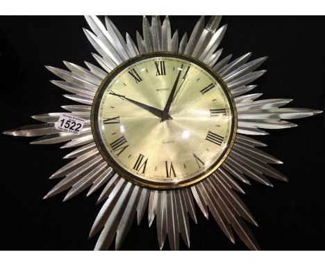 Metamec quartz sunburst clock, some creasing to metal surround, dial D: 19 cm, working at time of lotting. P&amp;P Group 3 (£