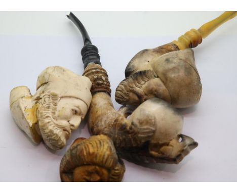 Four carved Meerschaum pipes with damages. P&amp;P Group 2 (£18+VAT for the first lot and £3+VAT for subsequent lots) 