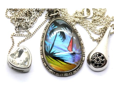 Three silver pendants on silver chains. P&amp;P Group 1 (£14+VAT for the first lot and £1+VAT for subsequent lots) 