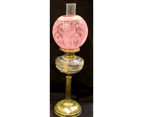Victorian brass oil lamp with Cranberry glass shade, H: 90 cm. Not available for in-house P&amp;P, contact Paul O'Hea at Mail
