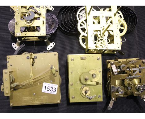 Five brass clock movements. P&amp;P Group 3 (£25+VAT for the first lot and £5+VAT for subsequent lots) 