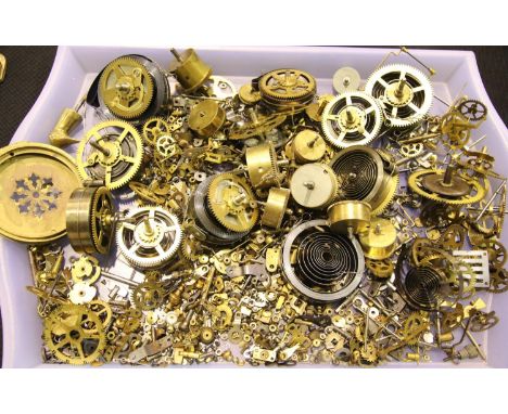 Assorted clock parts including springs and cogs. P&amp;P Group 3 (£25+VAT for the first lot and £5+VAT for subsequent lots) 
