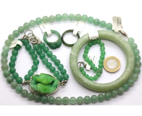 Two jade rings, a jade bangle, two jade bracelets and a necklace. P&amp;P Group 1 (£14+VAT for the first lot and £1+VAT for s