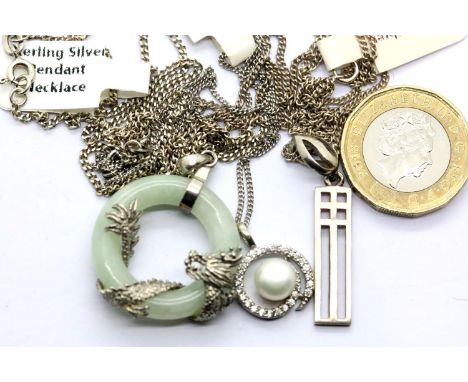 Three silver pendants on silver chains including a jade example. P&amp;P Group 1 (£14+VAT for the first lot and £1+VAT for su