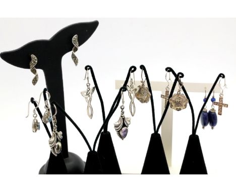Seven pairs of silver earrings on display stands. P&amp;P Group 1 (£14+VAT for the first lot and £1+VAT for subsequent lots) 