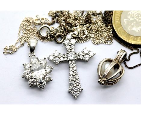 Three silver pendants on silver chains. P&amp;P Group 1 (£14+VAT for the first lot and £1+VAT for subsequent lots) 
