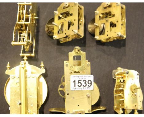 Six small brass clock movements. P&amp;P Group 2 (£18+VAT for the first lot and £3+VAT for subsequent lots) 