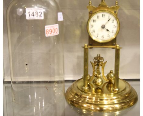 Glass domed brass anniversary clock with detached pendulum, H: 27 cm. P&amp;P Group 3 (£25+VAT for the first lot and £5+VAT f