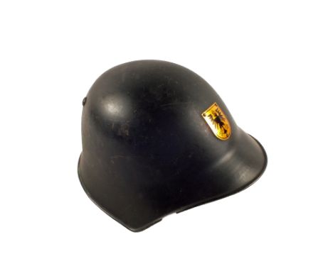 Scarce Cold War era Austrian helmet with riveted badge and original strap and liner