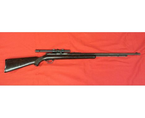 A .22 RF self loading rifle by Higgins including a vintage Higgins (trademark) scope. This item can only be purchased by some