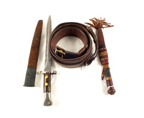 A mixed lot including 1988 model bayonet with scabbard (as found), a Sam Browne and a native dagger in leather sheath