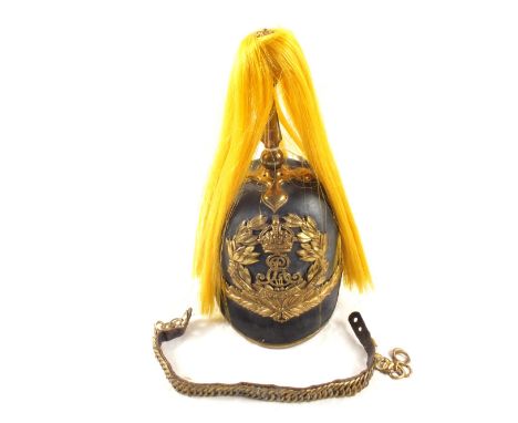 A Norfolk Yeomanry leather helmet with Edward VII Brass plate, spike with original yellow horsehair plume.  Chin strap presen