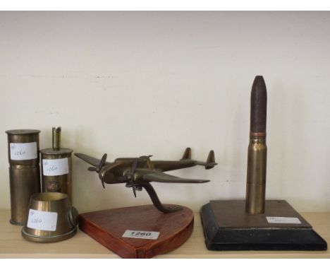 Five items of "Trench Art" including lighters and a plane