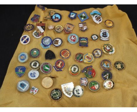 A collection of enamel bowls badges