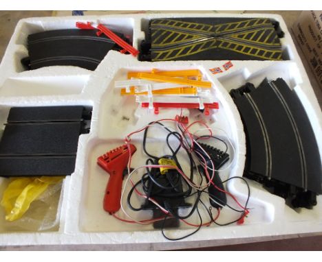 Three boxed and other Scalextric cars and Formula 1 box and track