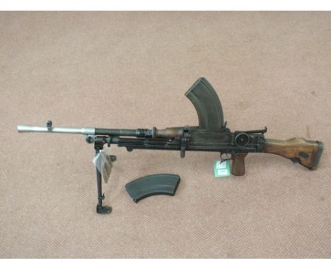 A MkI Bren light machine gun, action marked "Inglis 1942".  This iconic arm comes with two magazines and transit chest.  De-a