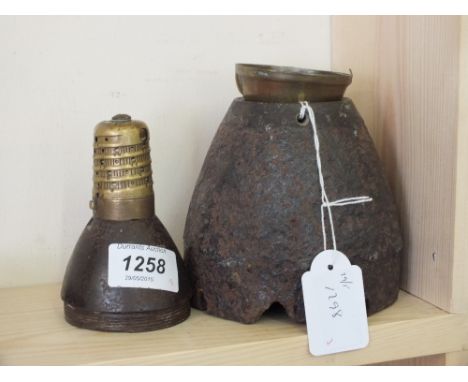 A shell nose (battlefield find) with a shell nose with timer and a timer cover