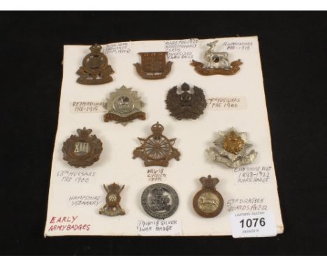 A collection of ten early 20th Century badges including Victorian 13th Hussars, Army Cyclist Corps and a Silver 1914-1918 War