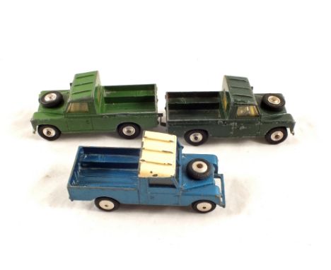 Three play worn Corgi Land Rovers, a Britians Land Rover and two Matchbox Esso and Shell